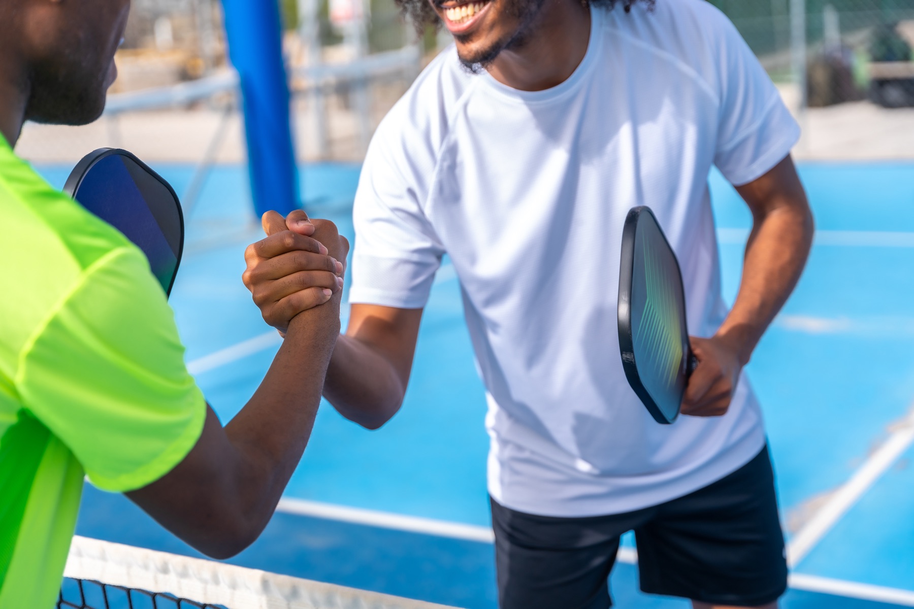 Pickleball players shaking hands before their match