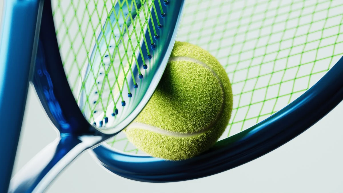 Yellow tennis ball between two blue rackets with green strings